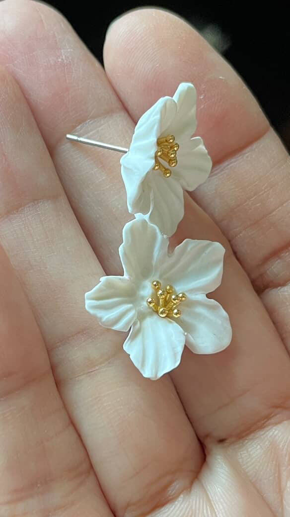 White jasmine earrings in hand