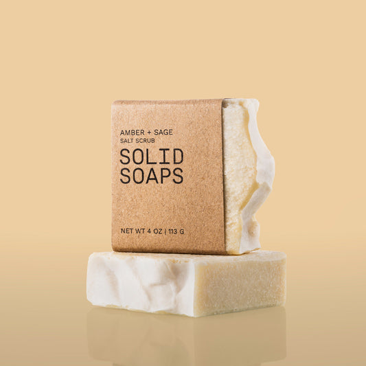 Amber + Sage Salt Scrub soap with kraft wrap and beige background