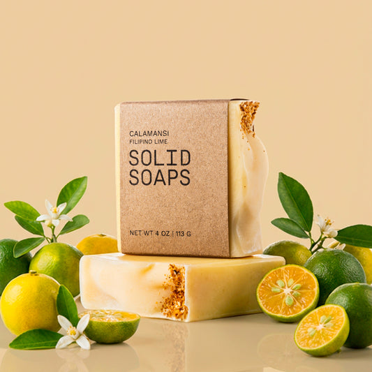 Solid Soaps Calamansi soap with calamansi fruits and flowers around it
